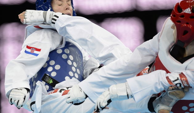London, 080812.Excel dvorana.Hrvatska taekwondokasica Lucija Zaninovic u kategoriji do 49 kg tokom Olimpijskih Igara u Londonu.Na fotografiji: u cetvrtfinalu pobjedila argentinku Lopez Rodriguez Carola Malvinu te usla u polufinale.Foto: Drago Sopta /