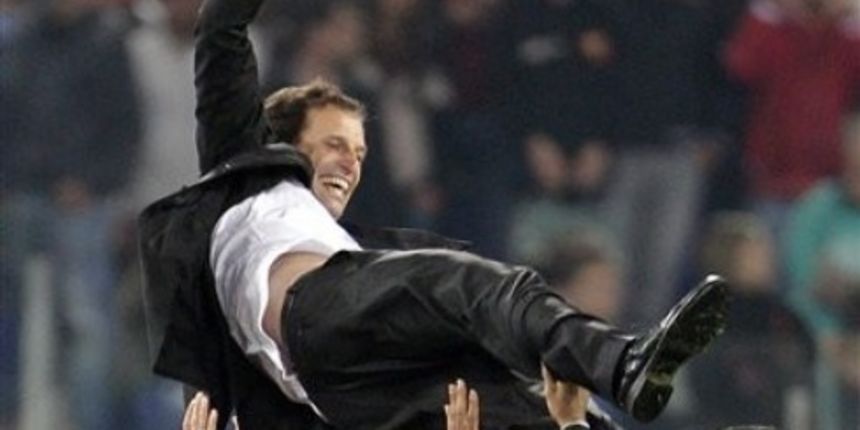 AC Milan coach Massimiliano Allegri is thrown in the air in celebration // AP Photo