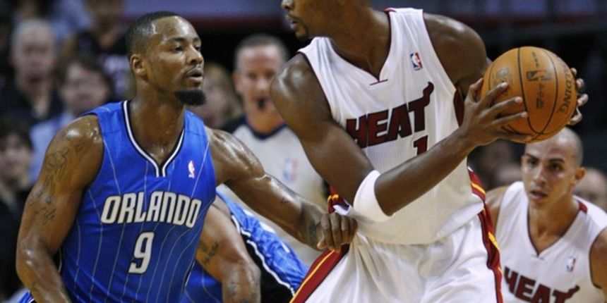 Miami Heat Chris Bosh (R) looks for an opening against the defense of Orlando Magic Rashard Lewis // Reuters Miami Heat Chris Bosh (R) looks for an opening against the defense of Orlando Magic Rashard Lewis // Reuters