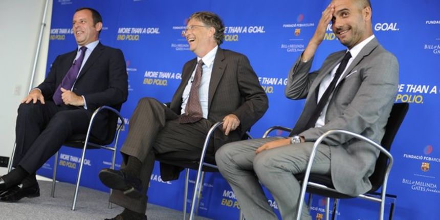 Microsoft Chairman Bill Gates (C) laughs with FC Barcelona President Sandro Rosell (L) and manager Josep Guardiola // Reuters