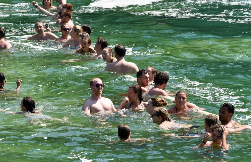 Rješenje za osvježenje: Kupanje u ledenoj rijeci Krki u NP Krka. Photo: Hrvoje Jelavić/PIXSELL