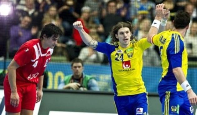 Sweden’s Fredrik Petersen (C) cheer with Tobias Karlsson (R) after scoring, with Chile’s Erwin Feuchtmann on the left // AP Photo