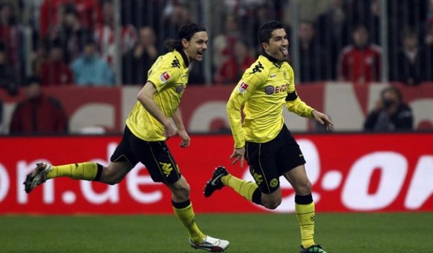 Borussia Dortmund’s Nuri Sahin (R) celebrates with Neven Subotic // Reuters