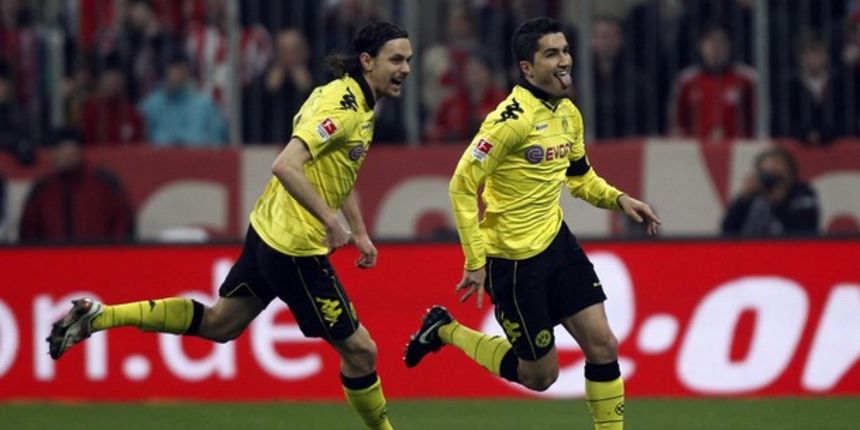 Borussia Dortmund’s Nuri Sahin (R) celebrates with Neven Subotic // Reuters Borussia Dortmund’s Nuri Sahin (R) celebrates with Neven Subotic // Reuters