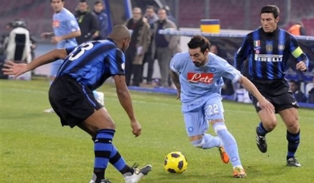 Napoli forward Ezequiel Lavezzi, of Argentina, right, tries to dribble past Inter Milan Brazilian defender Maicon, left // AP Photo