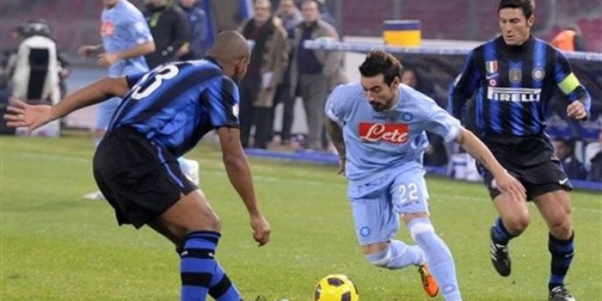 Napoli forward Ezequiel Lavezzi, of Argentina, right, tries to dribble past Inter Milan Brazilian defender Maicon, left // AP Photo