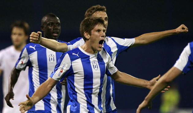 Zagreb, 190812.Stadion u Maksimiru.Nogometna utakmica 5.kola 1.HNL izmedju HNK Hajduk i NK Lokomotiva.Na fotografiji: Andrej Kramaric i Marcelo Brozovic slave gol za Lokomotivu.Foto: Ronald Gorsic / CROPIX
