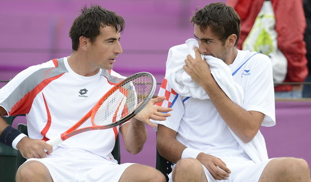 London, 010812.
Wimbledon Centar.
Hrvatski tenisaci Marin Cilic i Ivan Dodig 2. kolo u igri parova protiv svedskog para tokom Olimpijskih Igra u Londonu.
Foto: Drago Sopta / CROPIX