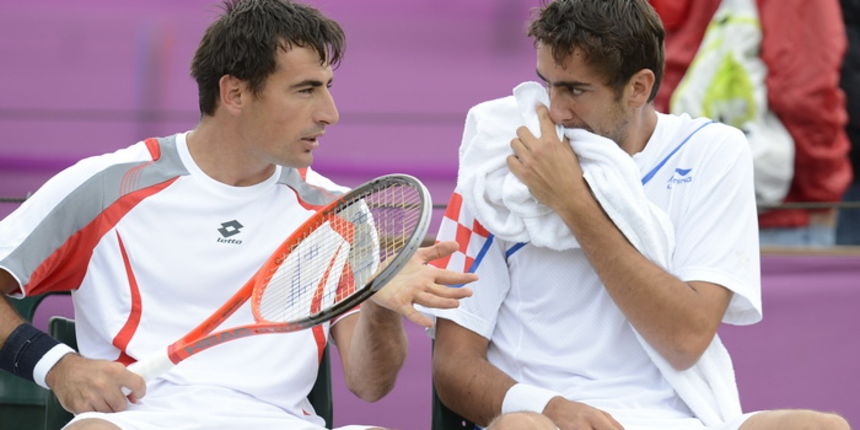London, 010812.
Wimbledon Centar.
Hrvatski tenisaci Marin Cilic i Ivan Dodig 2. kolo u igri parova protiv svedskog para tokom Olimpijskih Igra u Londonu.
Foto: Drago Sopta / CROPIX London, 010812.
Wimbledon Centar.
Hrvatski tenisaci Marin Cilic i Ivan Dodig 2. kolo u igri parova protiv svedskog para tokom Olimpijskih Igra u Londonu.
Foto: Drago Sopta / CROPIX