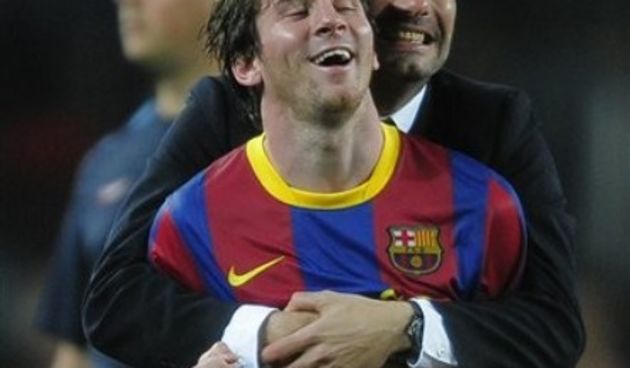 Lionel Messi from Argentina, front, and coach Josep Guardiola // AP Photo