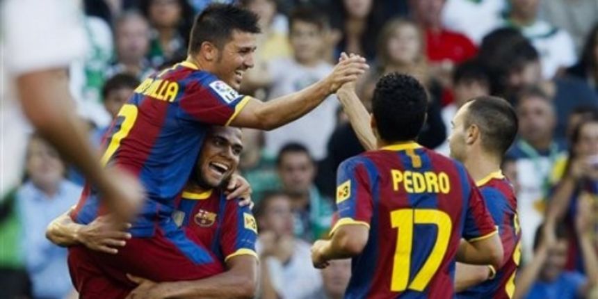 Barcelona’s David Villa, left top, celebrates with Daniel Alves of Brazil, bottom left, Pedro Rodriguez, center, and Andres Iniesta, right, after scoring against Racing de Santander during their La Liga soccer match at El Sardinero stadium in Santander, S Barcelona’s David Villa, left top, celebrates with Daniel Alves of Brazil, bottom left, Pedro Rodriguez, center, and Andres Iniesta, right, after scoring against Racing de Santander during their La Liga soccer match at El Sardinero stadium in Santander, S