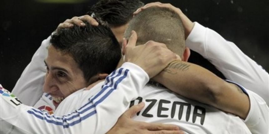 Real Madrid’s Karim Benzema from France, center, reacts after scoring against Levante with members Angel Di Maria // AP Photo Real Madrid’s Karim Benzema from France, center, reacts after scoring against Levante with members Angel Di Maria // AP Photo