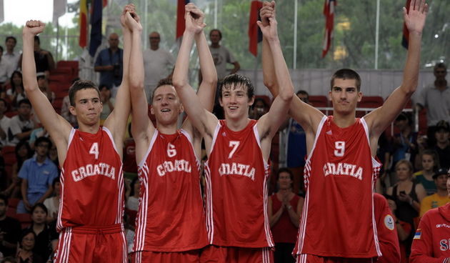 The Croatian team reacts as they step onto the podium to receive their boys basketball Silver at the medals ceremony on day 8 of basketball at the Singapore 2010 Youth Olympic Games (YOG) at the *Scape Youth Space, Aug 23, 2010. Photo: SPH-SYOGOC/Joseph N