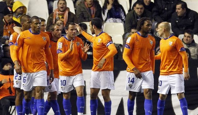 Malaga’s players celebrate after they scored // Reuters