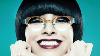 Young woman with black bob land hands on chin — Image by © Ocean/Corbis Young woman with black bob land hands on chin — Image by © Ocean/Corbis