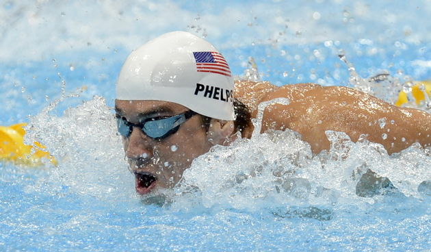 London, 020812.
Aquatics Centar.
Americki plivac Michael Phelps rekorder po osvojenim zlatnim medaljama u Pekingu te osvojenih najvise medalja na Olimpijskim Igrama tokom kvalifikacijske utrke 200 metara leptir tokom Olimpijskih Igra u Londonu.
Foto: Drag