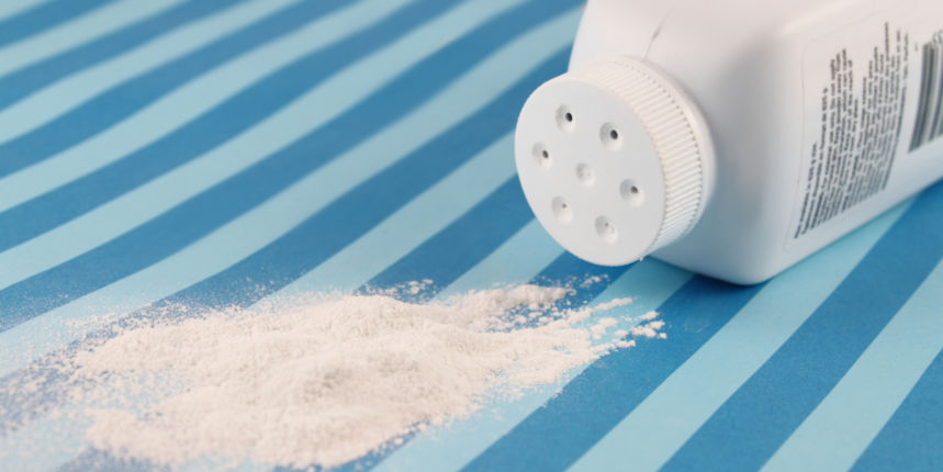 Spilled baby scented powder on striped background with short depth of field Spilled baby scented powder on striped background with short depth of field