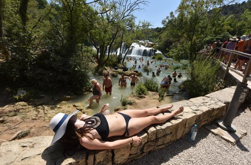 Vrelo ljeto u Nacionalnom parku Krka, hlađenje u Skradinskom buku. Photo: Hrvoje Jelavić/PIXSELL Vrelo ljeto u Nacionalnom parku Krka, hlađenje u Skradinskom buku. Photo: Hrvoje Jelavić/PIXSELL