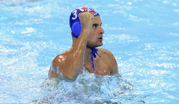 London, Velika Britanija, 290712.
Vaterpolo Arena.
Hrvatska muska vaterpolo reprezentacija igra utakmicu 1. kola u skupini A protiv Grcke tijekom Olimpijskih igara u Londonu.
Na fotografiji: Miho Boskovic slavi nakon gola.
Foto: Drago Sopta / CROPIX