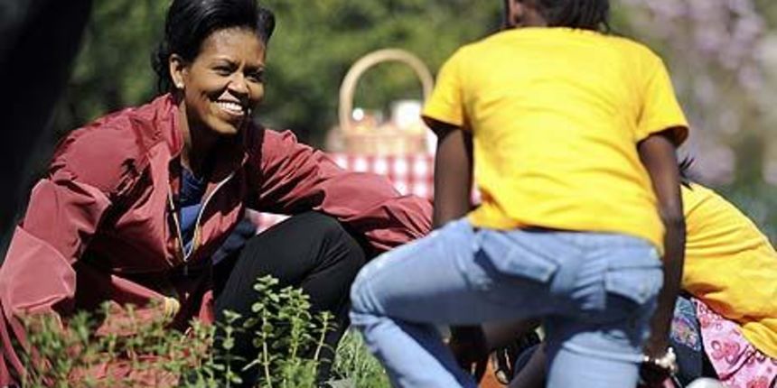 US first lady Michelle Obama smiles as she helps students plant herbs in the White House Kitchen Garden…US first lady Michelle Obama (L) smiles as she helps students plant herbs in the White House Kitchen Garden on the South Lawn of the White House in W US first lady Michelle Obama smiles as she helps students plant herbs in the White House Kitchen Garden…US first lady Michelle Obama (L) smiles as she helps students plant herbs in the White House Kitchen Garden on the South Lawn of the White House in W
