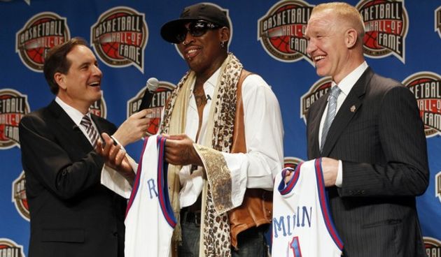 Five time NBA champion Dennis Rodman (C) talks with Jim Nantz (L) as fellow class member Chris Mullin looks on during the Naismith Memorial Basketball Hall of Fame Announcement of the Class of 2011 // Reuters