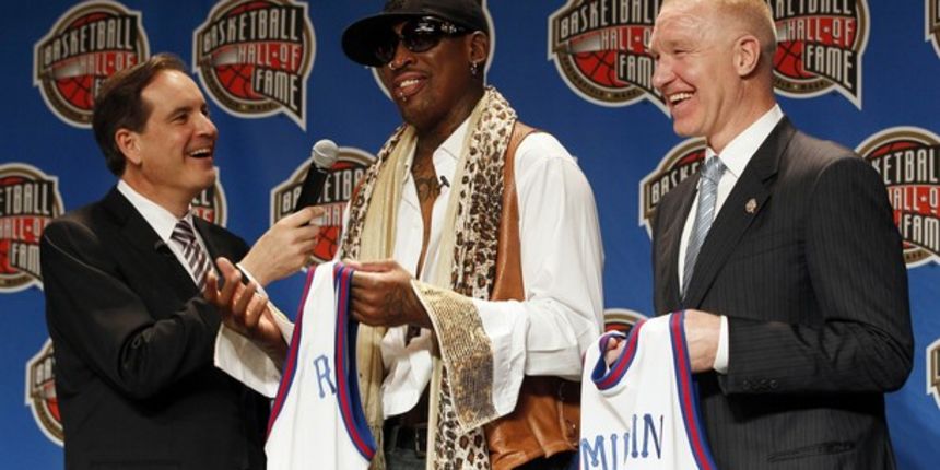 Five time NBA champion Dennis Rodman (C) talks with Jim Nantz (L) as fellow class member Chris Mullin looks on during the Naismith Memorial Basketball Hall of Fame Announcement of the Class of 2011 // Reuters