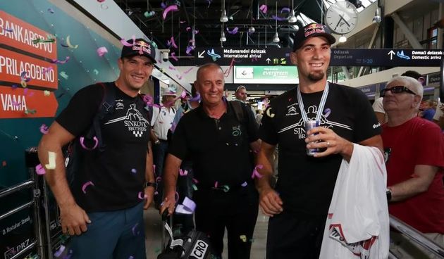 07.09.2015., Zagreb – U Zracnoj luci Zagreb docekana su braca Martin i Valent Sinkovic, svjetski prvaci u veslanj. Braca Sinkovic sa svojim trenerom Nikolom Bralicem. Photo: Tomislav Miletic/PIXSELL