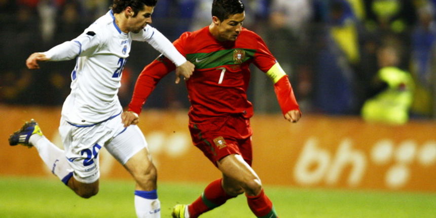 Zenica, 111111. Kvalifikacijska utakmica za Europsko prvenstvo 2012, izmedju Bosne i Hercegovine i Portugala.Na slici: Adnan Zahirovic i Cristiano Ronaldo se bore za loptu. Foto: CROPIX Zenica, 111111. Kvalifikacijska utakmica za Europsko prvenstvo 2012, izmedju Bosne i Hercegovine i Portugala.Na slici: Adnan Zahirovic i Cristiano Ronaldo se bore za loptu. Foto: CROPIX