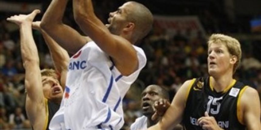 Tony Parker, center, from France shoots a ball past Heiko Schaffartzik, left, and Jan-Hendrik Jagla, right, both from Germany // AP Photo Tony Parker, center, from France shoots a ball past Heiko Schaffartzik, left, and Jan-Hendrik Jagla, right, both from Germany // AP Photo