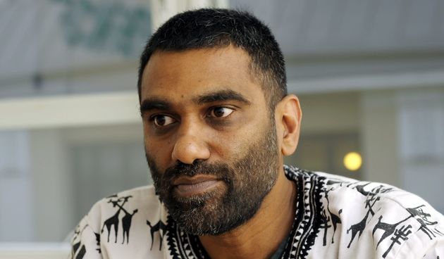 South African human rights activist and international executive director of environmentalist group Greenpeace Kumi Naidoo gives a press conference in Helsinki, Finland, on October 15, 2013, on the current situation of detained Arctic Sunrise ship activist