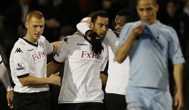 Fulham’s Mousa Dembele, center, celebrates scoring with Steve Sidwell, left, and John Pantsil as Tottenham Hotspur’s Steven Pienaar, right, reacts during their English FA Cup fourth round soccer match // AP Photo