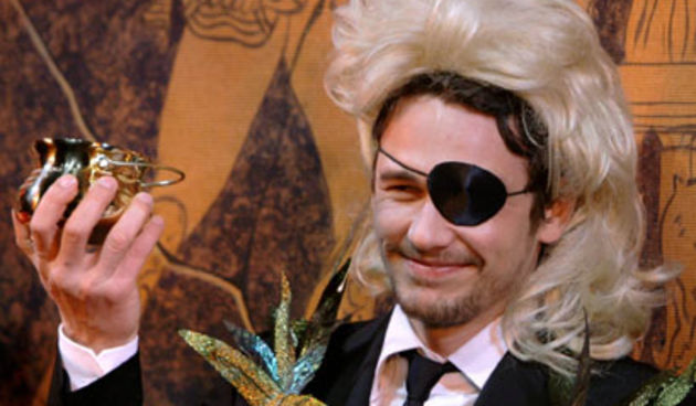 Actor James Franco holds up his pudding pot award as he is honored as Harvard University’s Hasty Pudding Theatricals Man of the Year in Cambridge, Mass., Friday Feb. 13, 2009. (AP Photo/Charles Krupa)