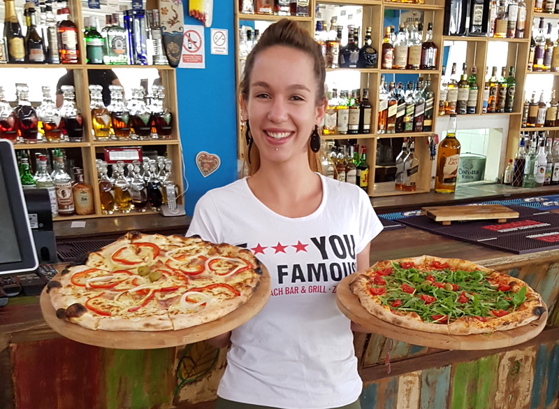 Vrhunska ponuda pizza i hamburgera u Famous Beach Bar & Grillu. Predstavljamo pizze Bianca i Rukola & Mozarella te Famous i Western hamburgeri