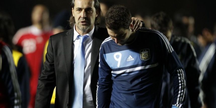Sergio Batista (L) walks off the field with Gonzalo Higuain // Reuters Sergio Batista (L) walks off the field with Gonzalo Higuain // Reuters