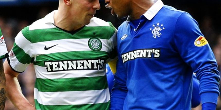 Celtic’s Scott Brown (L) talks with Rangers’ El Hadji Diouf  // Reuters