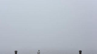 Zadar već treći dan okovan gustom maglom. Foto: Dino Stanin/Pixsell