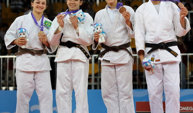 Judo wrestlers (from left to right) Flavia Gomes of Brazil wins the silver medal, Miku Tashiro of Japan wins gold and Croatia’s Barbara Matic & Lithuania’s Laura Naginskaite both win bronze medals, in the girl’s Judo under 63 kg contest of the 2010 Yout