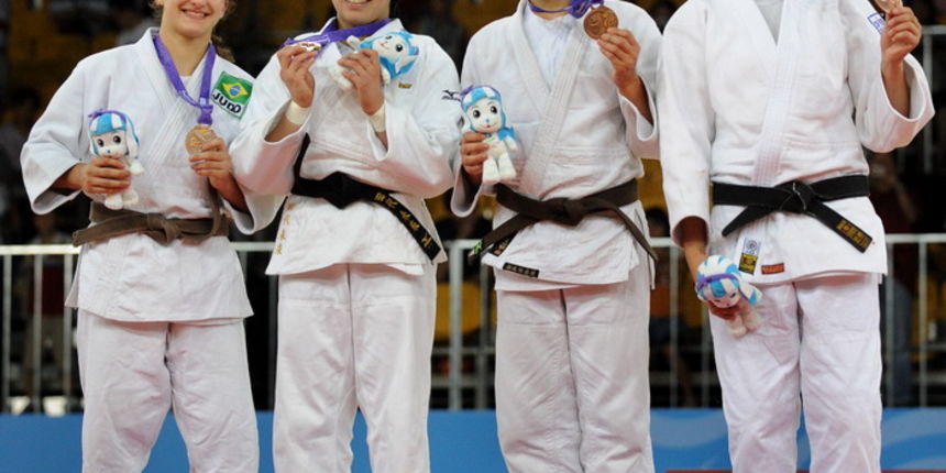 Judo wrestlers (from left to right) Flavia Gomes of Brazil wins the silver medal, Miku Tashiro of Japan wins gold and Croatia’s Barbara Matic & Lithuania’s Laura Naginskaite both win bronze medals, in the girl’s Judo under 63 kg contest of the 2010 Yout