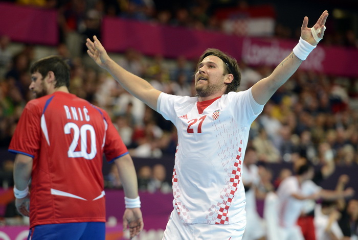 London, 310712.
Dvorana Copper Box.
Hrvatska muska rukometna reprezentacija igra utakmicu 2. kolo u skupini B protiv Srbije tokom Olimpijskih Igra u Londonu.
Na fotografiji: Ivan Cupic slavi nakon gola.
Foto: Drago Sopta / CROPIX