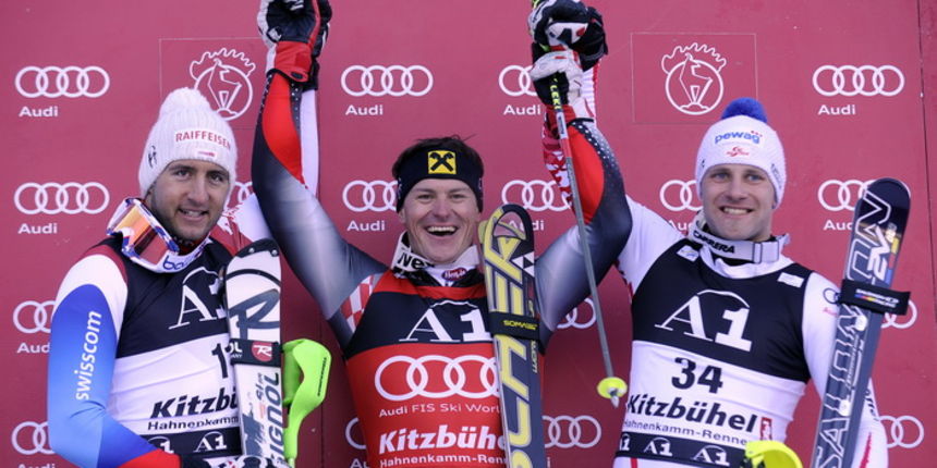 Kitzbuhel, 230111. Fis Audi World Cup u Kitzbuhelu, Svjetski skijaski kup u Kitzbuhelu, postolje pobjednika nakon slalomske utrke i kombinacije. Na slici: pobjednik kombinacije Ivica Kostelic, drugi svicarac Zurbriggen i treci austrijanac Baumann. Foto: D