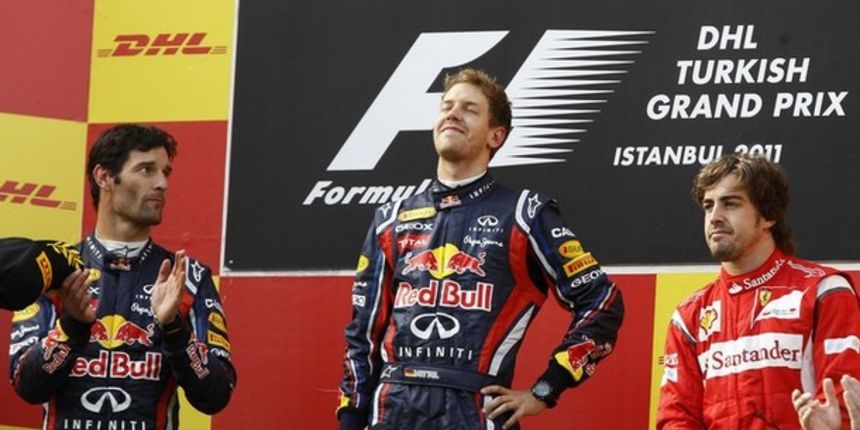 First placed Red Bull Formula One driver Sebastian Vettel of Germany (C), his team mate second placed Mark Webber of Australia (L) and third placed Ferrari Formula One driver Fernando Alonso of Spain // Reuters First placed Red Bull Formula One driver Sebastian Vettel of Germany (C), his team mate second placed Mark Webber of Australia (L) and third placed Ferrari Formula One driver Fernando Alonso of Spain // Reuters