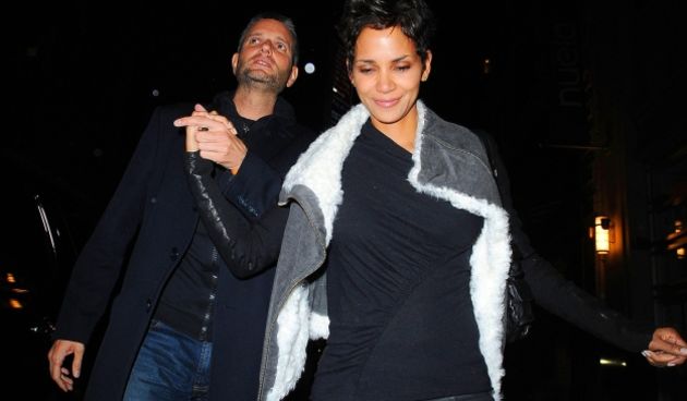 #5841547 Halle Berry is all smiles as she steps out in the rain to dine at Nuela with a male companion in New York City, NY on October 4, 2010.  With rumors abounding that Berry is involved with Olivier Martinez who is this new male dinner partner?
 Fame