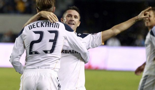 Los Angeles Galaxy’s Robbie Keane celebrates with teammate David Beckham  // Reuters