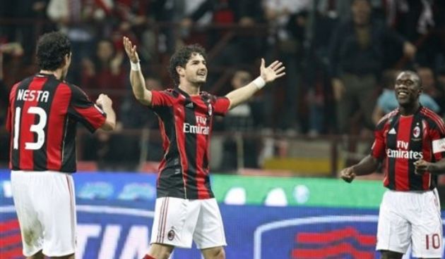 AC Milan Brazilian forward Pato, center, celebrates with his teammates Alessandro Nesta, left, and Clarence Seedorf, of the Netherlands, after scoring during the Serie A soccer match between AC Milan and Inter Milan // AP Photo