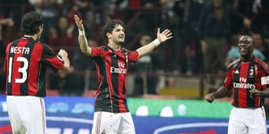 AC Milan Brazilian forward Pato, center, celebrates with his teammates Alessandro Nesta, left, and Clarence Seedorf, of the Netherlands, after scoring during the Serie A soccer match between AC Milan and Inter Milan // AP Photo