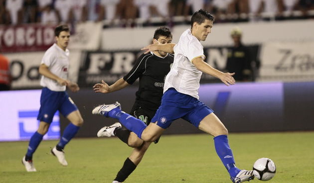 Split 190810.
Stadion NK Hajduka u Poljudu
Predkolo Evropskog kupa : NK Hajduk – Unirea 
Na fotografiji : Jurica Buljat i  Raul Andrei.
Foto: Vladimir Dugandzic / CROPIX