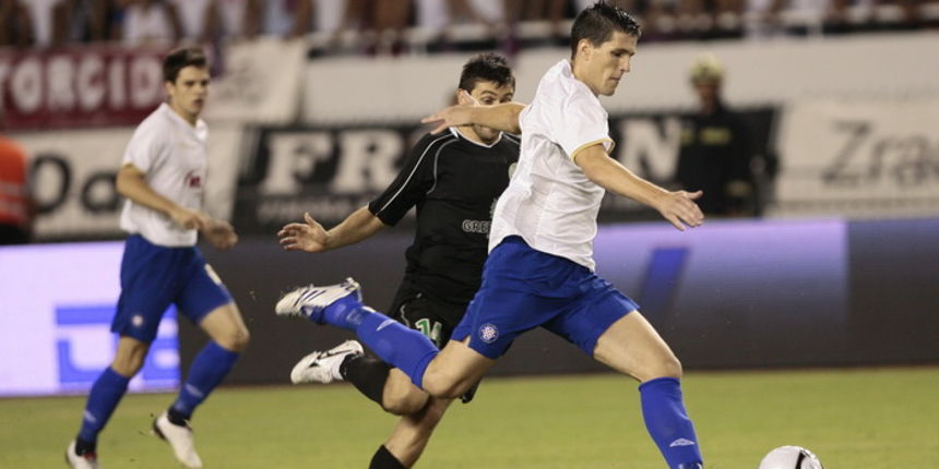 Split 190810.
Stadion NK Hajduka u Poljudu
Predkolo Evropskog kupa : NK Hajduk – Unirea 
Na fotografiji : Jurica Buljat i  Raul Andrei.
Foto: Vladimir Dugandzic / CROPIX