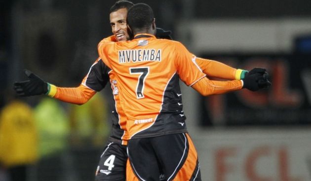 Romao (L) of FC Lorient celebrates with team mate Arnold Mvuemba // Reuters