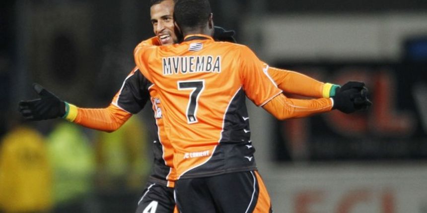 Romao (L) of FC Lorient celebrates with team mate Arnold Mvuemba // Reuters Romao (L) of FC Lorient celebrates with team mate Arnold Mvuemba // Reuters