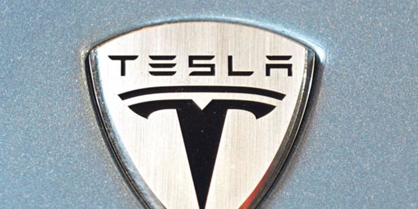 The logo of theTesla Roadster electric car is seen in the new showroom in Los Angeles, May 6, 2008. Tesla Motors develops and manufactures electric sport vehicles, while conforming to all US safety, environmental and durability standards. The 2008 model y